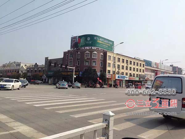 河北省邯郸市丛台区楼顶三面翻圆弧形广告牌案例图片